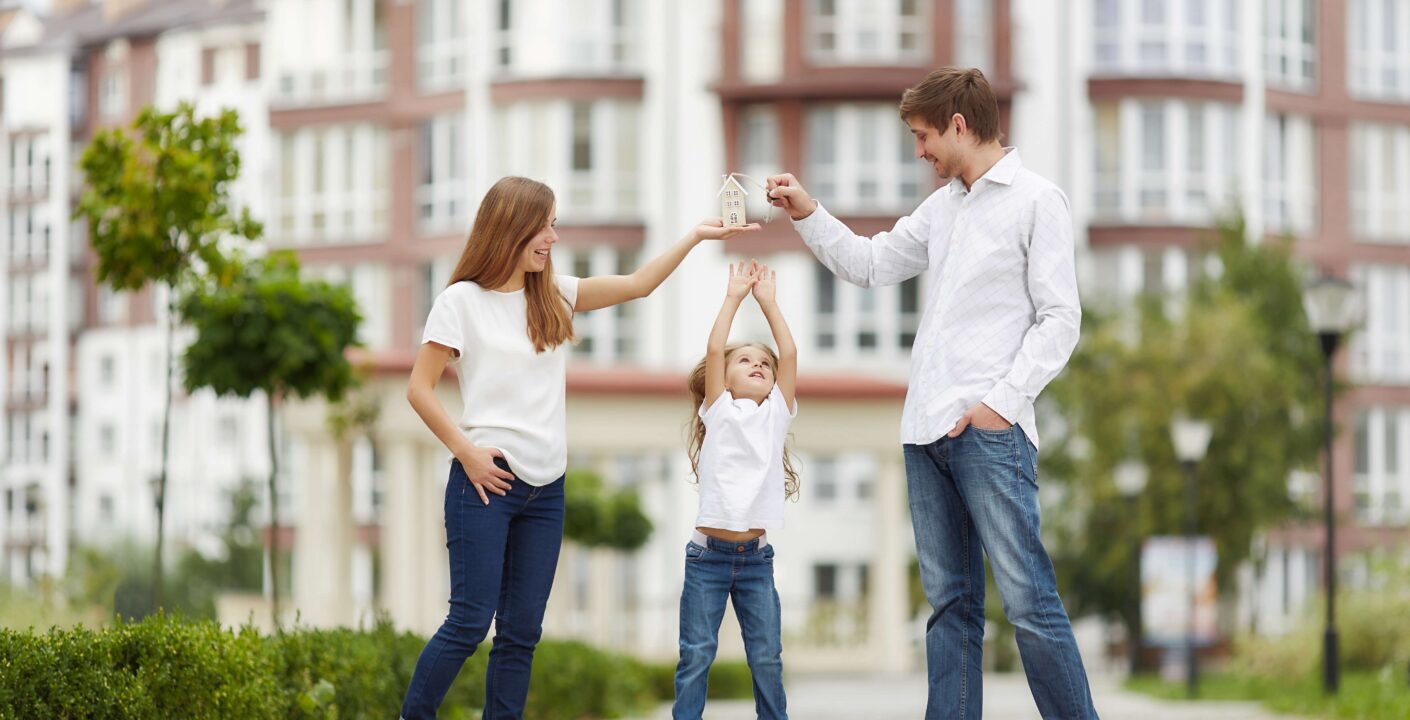 happy family front new apartment building