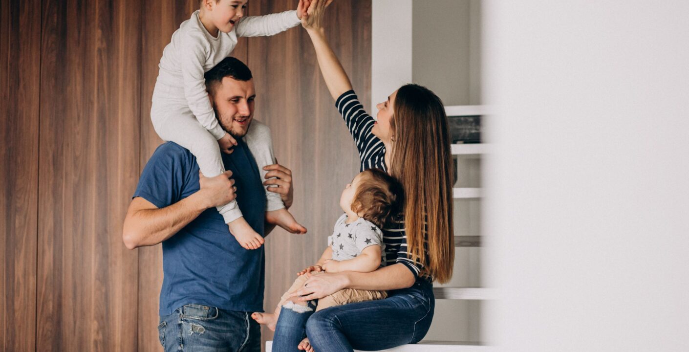 young family with their little son home having fun
