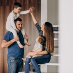 young family with their little son home having fun