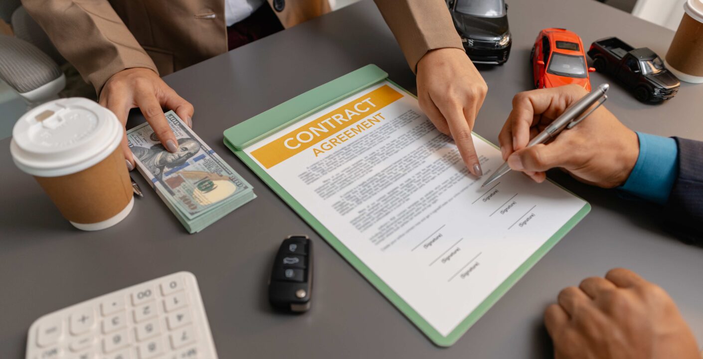 business meeting car dealer client discussing vehicle purchase agreement contract is being reviewed explained before signing representing trust cooperation